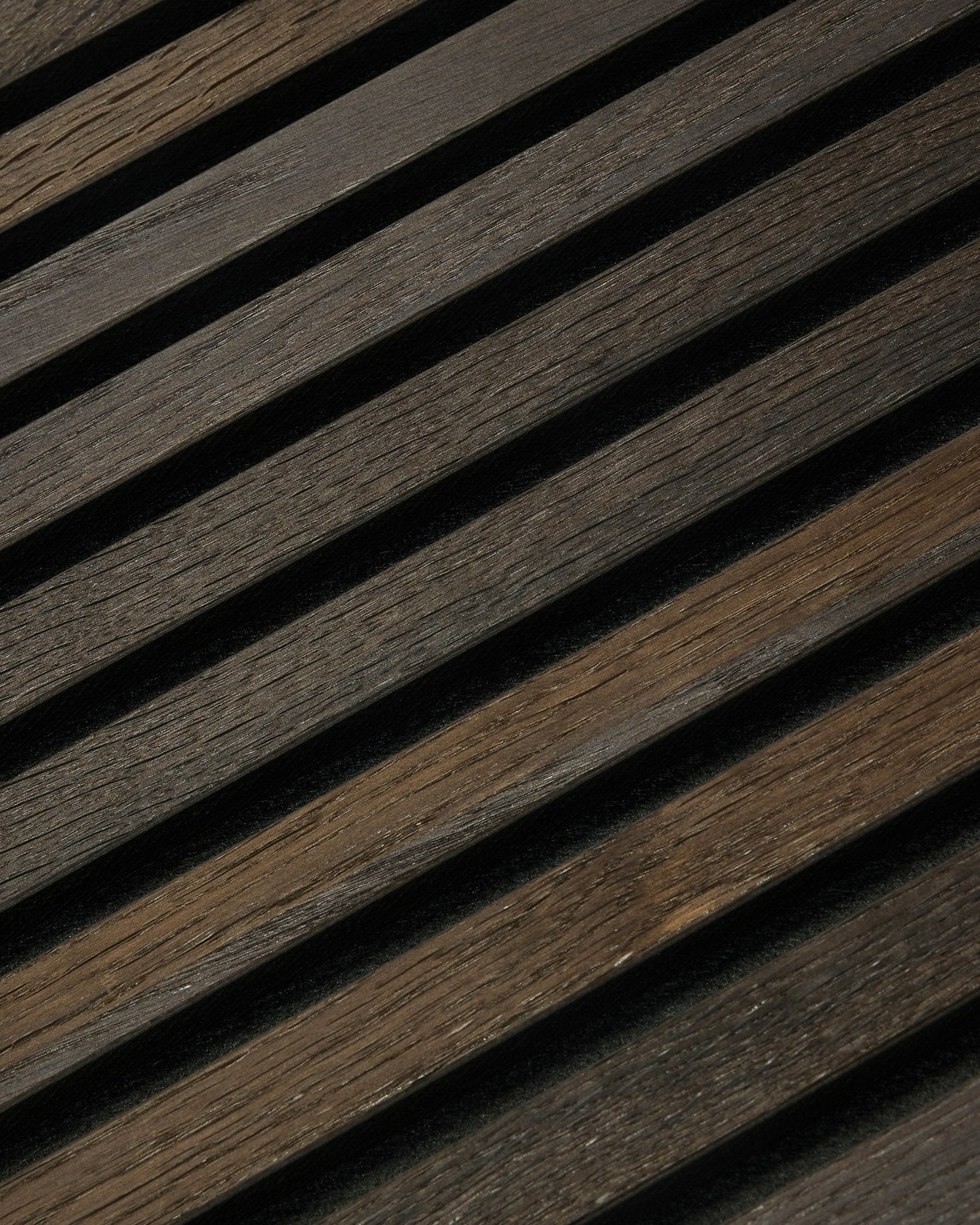 Close-up of WoodUpp Rustic Akupanel acoustic panel in Smoked Oak (300x60cm), showing visible wood grain, minimalist Nordic style, and linear shadow pattern.