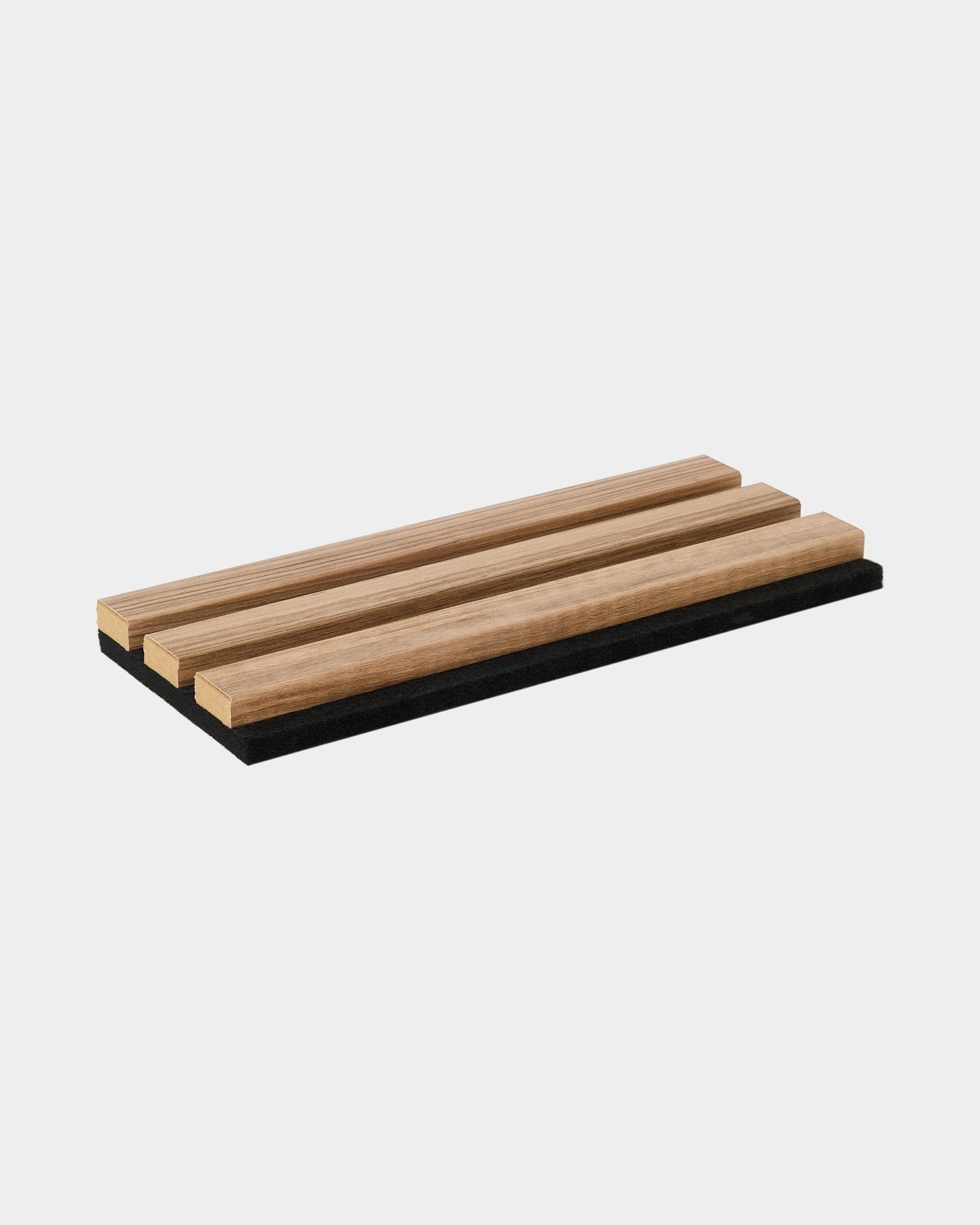 WoodUpp Essential trivet in English Walnut, featuring three parallel wooden slats on a black base; minimalist accessory for modern Nordic-inspired kitchens.