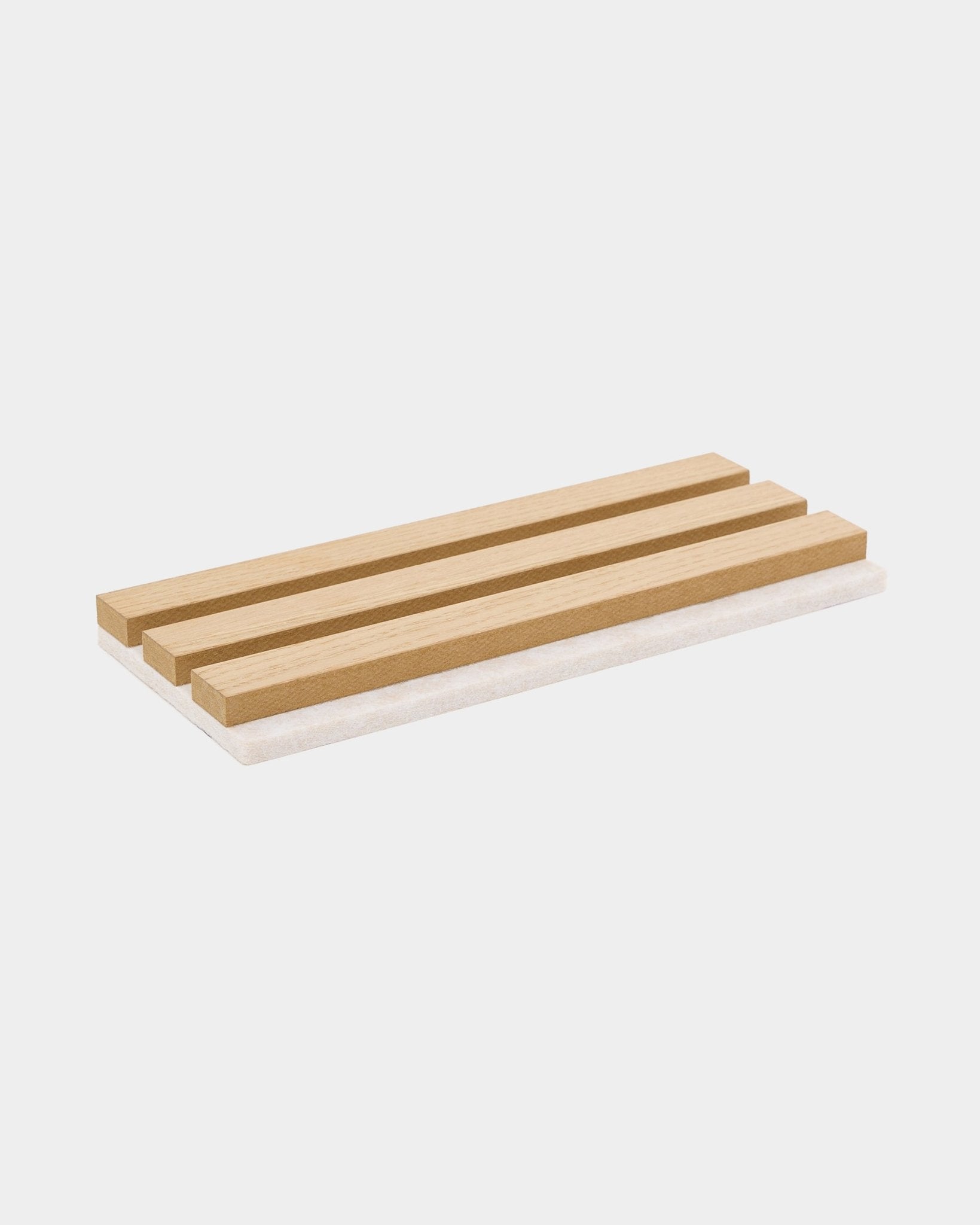 Rectangular wood soap dish with three slats, designed to complement WoodUpp Akupanel samples in Natural Wood or Classic Oak with light beige felt.