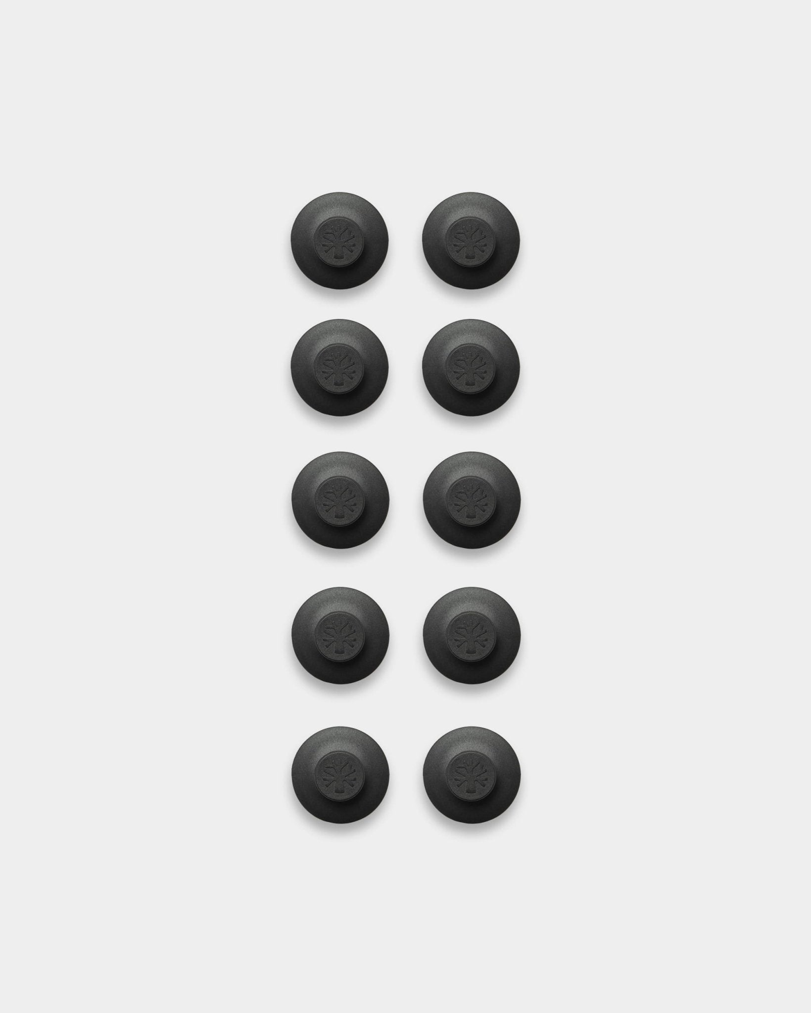 Ten black Dupps light thumb grips by WoodUpp, arranged in two columns on a white background—accessories for mounting acoustic panels, 10 pieces.