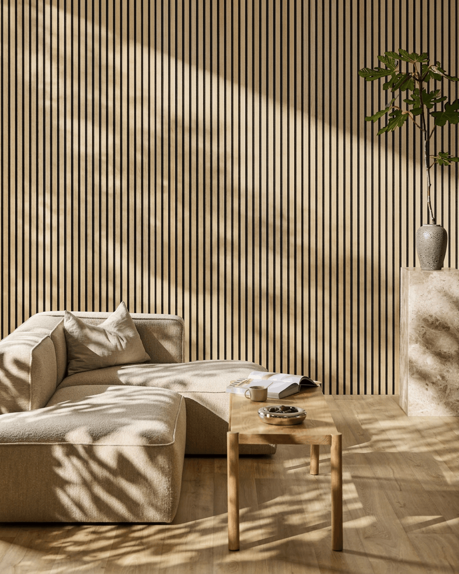 Minimalist living room featuring a beige sectional, wood coffee table, potted plant, and WoodUpp Akupanel classic oak acoustic panel with sunlight streaming in.